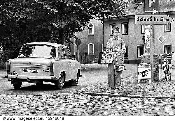 At last! The D-Mark is here is the headline of the German newspaper Bild am Sonntag (BamS) on the day of the currency union of the FRG and GDR. A Trabant with GDR license plates drives past the Sunday newspaper vendor. Loebau  Sachsen  GDR