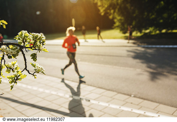 Athlete running in street