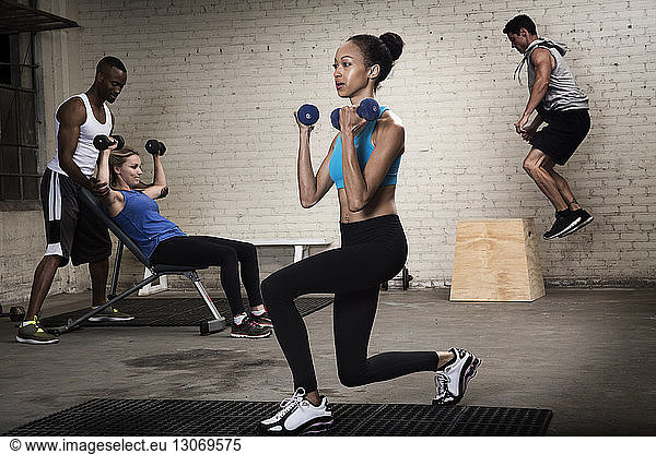 Athletes exercising in gym