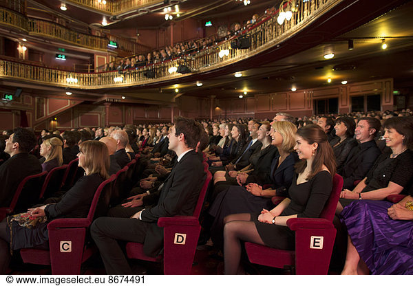 Audience watching performance in theater