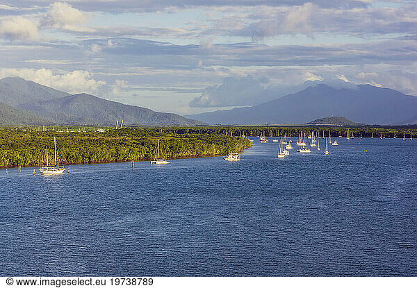 Australia  Queensland  Sailboats floating near shore at Cairns