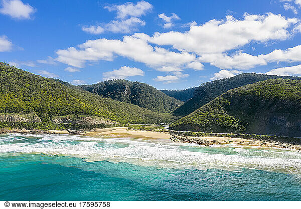 Australia  Victoria  Aerial view of beach and forested hills along Great Ocean Road in summer