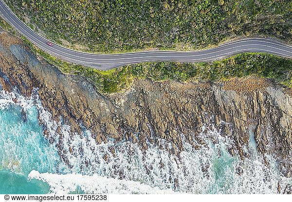 Australia  Victoria  Aerial view of rocky coastline and stretch of Great Ocean Road in summer