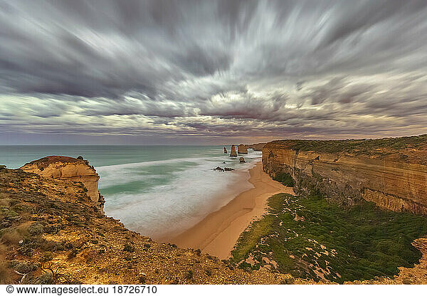 Australia  Victoria  Long exposure of sandy beach in Port Campbell National Park at cloudy dawn