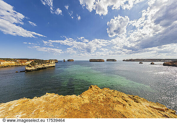 Australia Victoria Summer clouds over coastal landscape of Bay of Islands