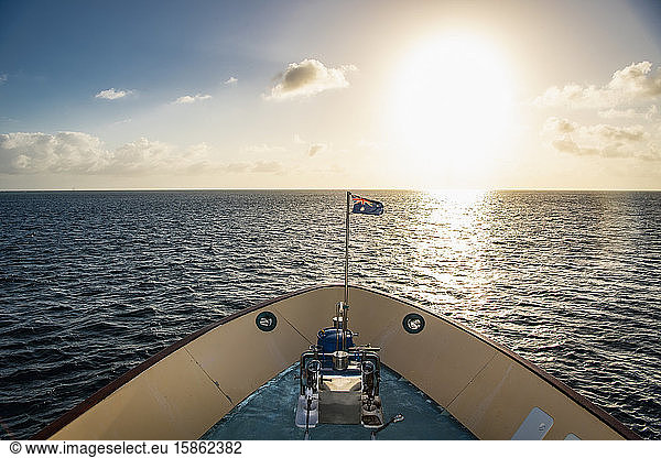Australian exploration vessel heading into the setting sun
