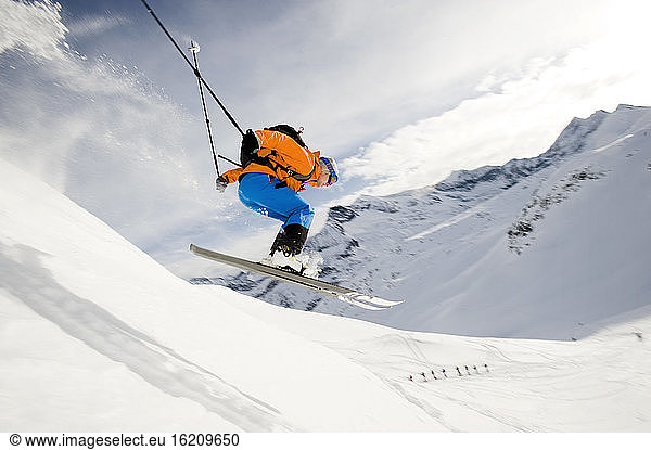 Austria  Man jumping with ski on mountain