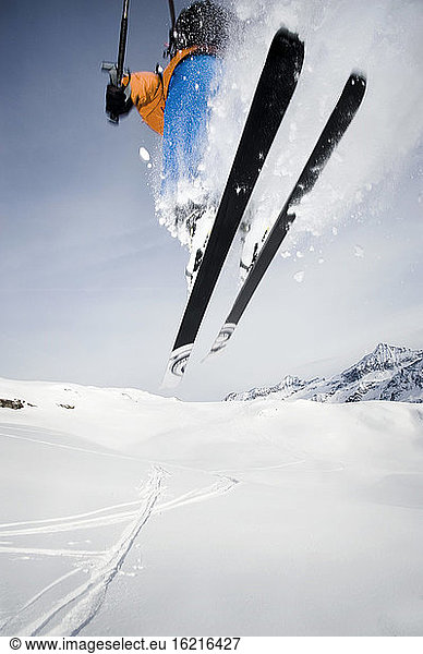 Austria  Man jumping with ski on mountain