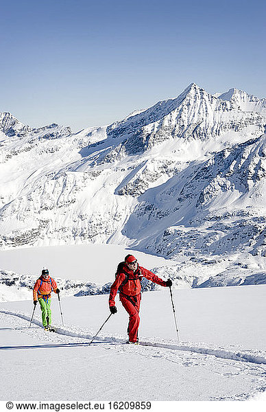 Austria  Men skiing on mountain at Salzburg Land