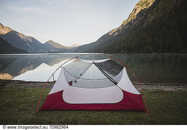 Austria  Plansee  Tent by lake Plansee in Austrian Alps at sunrise