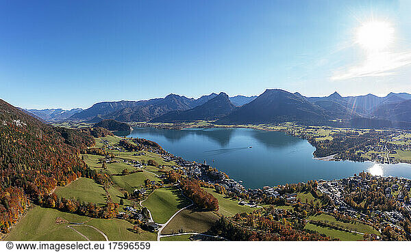 Austria  Salzburg  Sankt Wolfgang im Salzkammergut  Drone view of Lake Wolfgang and surrounding village on sunny autumn day