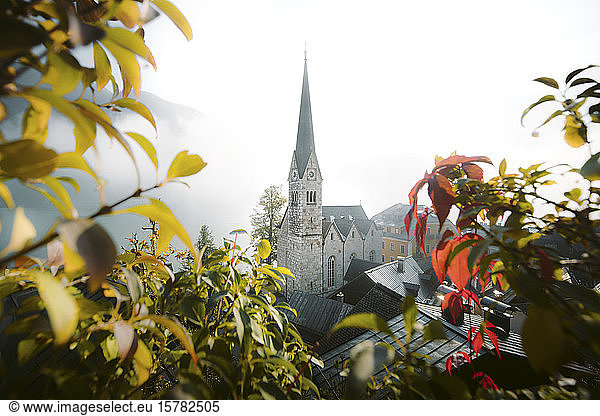 Austria  Salzkammergut region  Hallstatt church in fog at sunrise