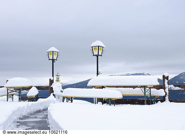 Austria  Styria  Murau  snow-capped benches and tables at ski hut