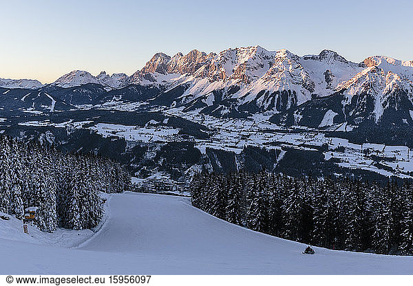 Austria  Styria  Schladming  Planai ski slope at dusk with Dachsteinmassiv in background