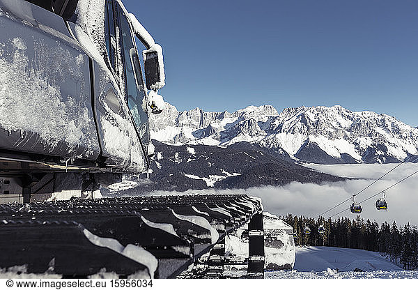 Austria  Styria  Schladming  Snowplow with Dachsteinmassiv in background