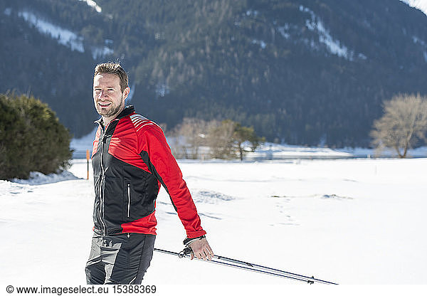 Austria  Tyrol  Achensee  portrait of smiling man doing cross country skiing