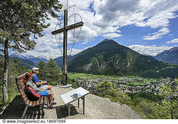 Austria  Tyrol  Imst  Hiking couple taking break at Wetterkreuz observation point