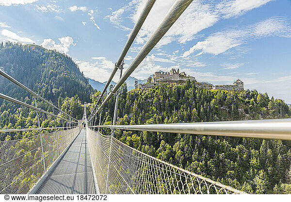 Austria  Tyrol  Reutte  Ehrenberg Castle seen from suspension bridge