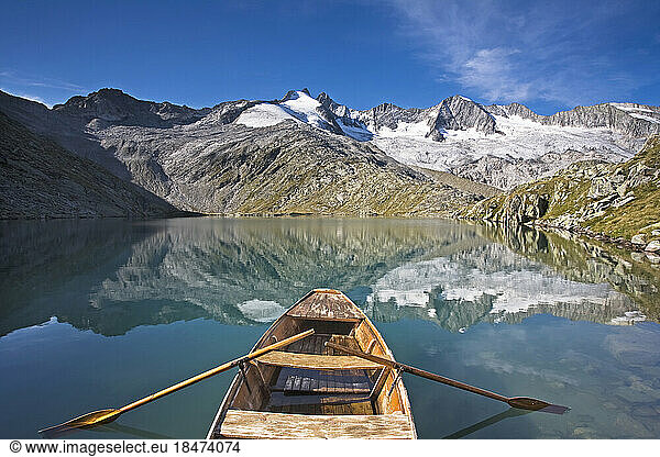 Austria  Tyrol  Rowboat floating in Oberer Gerlossee lake