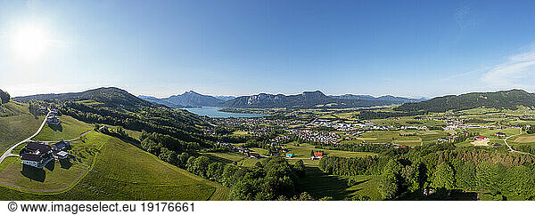 Austria  Upper Austria  Mondsee  Drone panorama of lakeshore village and surrounding landscape in summer