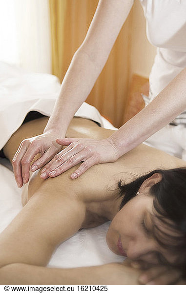Austria  Woman getting shoulder massage