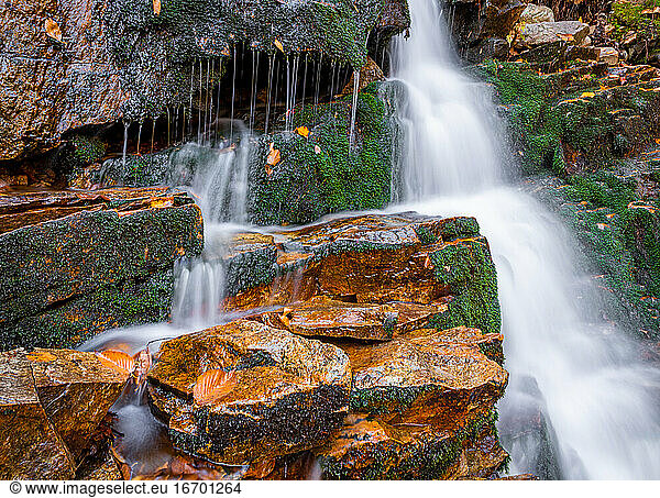 Autumn waterfall stream flowing in the New Hampshire mountains.