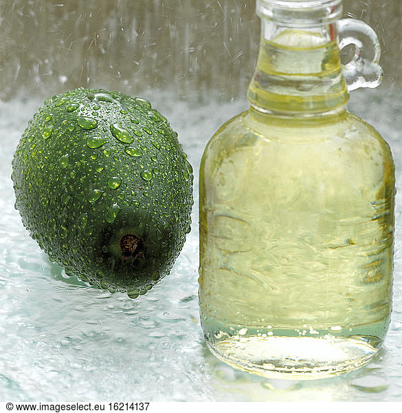 Avocado and soy bean oil in glass bottle  close-up