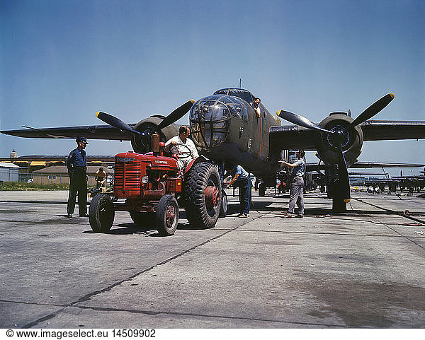 B-25 Bomber Planes Being Hauled along Outdoor Assembly Line by Tractor  North American Aviation  Inc.  Kansas City  Kansas  USA  Alfred T. Palmer for Office of War Information  October 1942