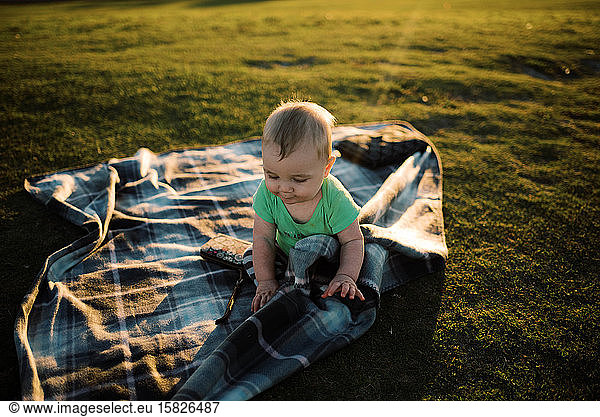 Baby boy at the park during sunset.
