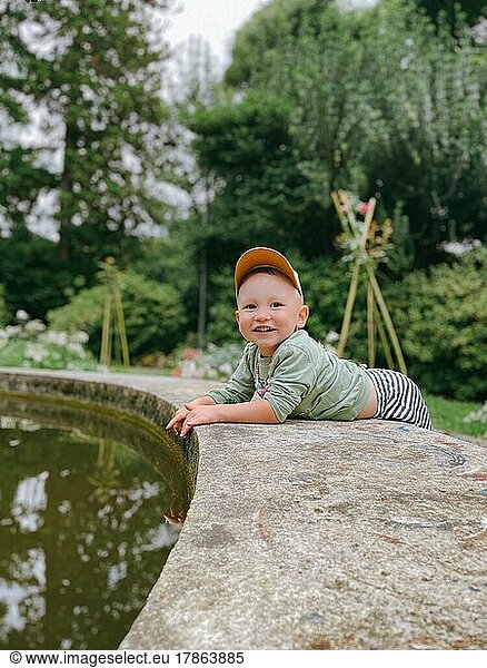 Baby boy near the pond