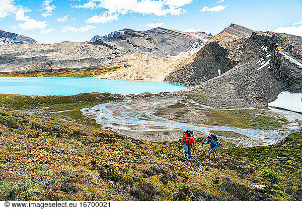 Backpackers Trekking into the Alpine Above Michelle Lakes