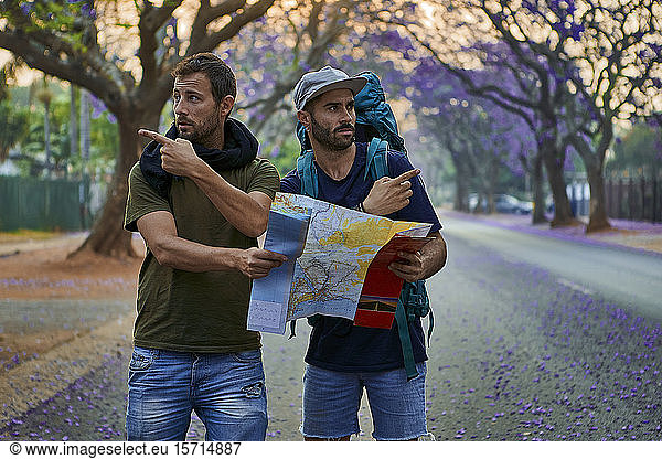 Backpackers with map on a street  Pretoria  South Africa