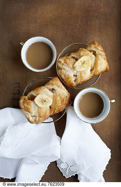 Baked pastries with banana and coffee