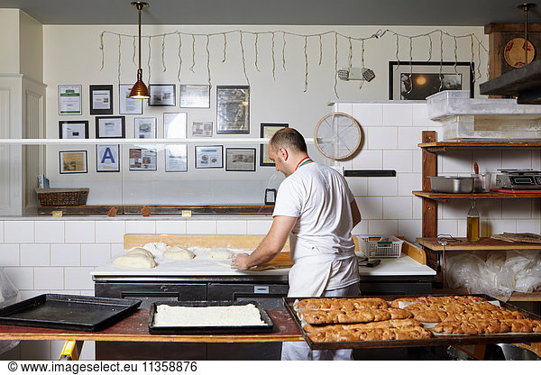 Baker working in bakery