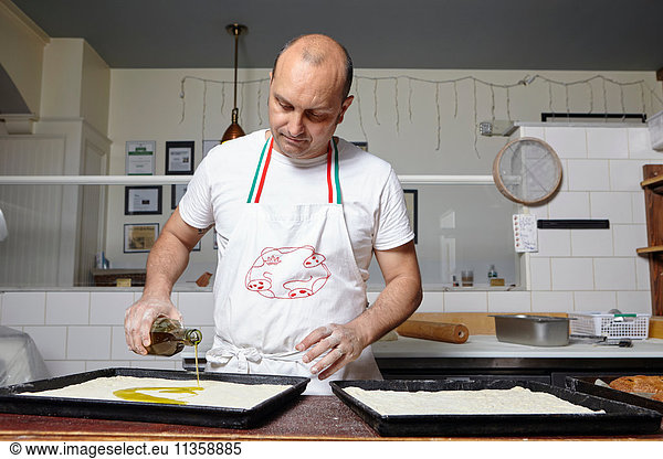 Baker working in bakery