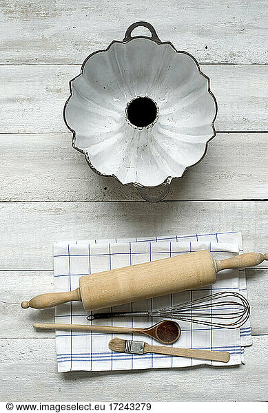 Baking utensils against rustic wooden background