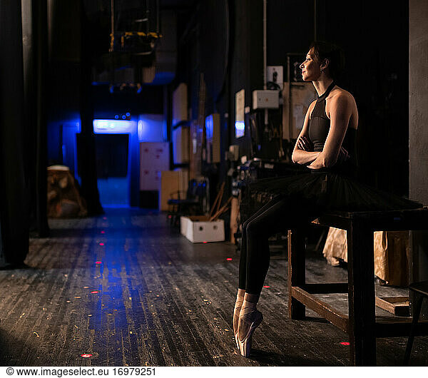 Ballet dancer waiting for performance behind stage