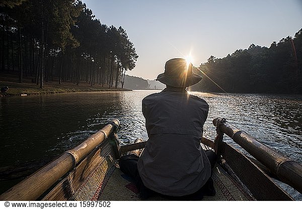 Bamboo raft ride at sunrise at Pang Ung Lake  Mae Hong Son  Thailand.