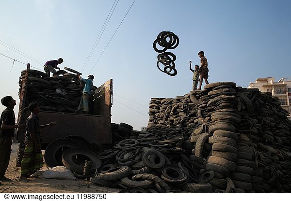 Bangladeshi child laborers handle pieces of old tyres to be recycled in Dhaka. The recycling industry in the Bangladeshi capital plays an important role as it struggles to curb waste in the city's population which has grown more than two and half times to 17 million people in the last two decades. A 2002/03 survey by the Bangladesh Bureau of Statistics found that approximately 4. 9 million children worked as child labourers in Bangladesh  14. 2 per cent of the total 35. 06 million children in the age group of 5-14 years. Bangladesh is one of the poorest nations on the planet with 40 percent of its 144 million people living on less than 1 dollar a day.