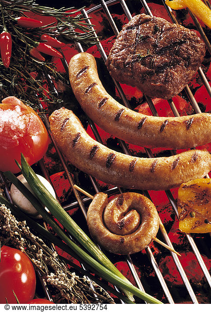 Barbecue: bratwurst snail  grilled bratwursts  steak and grilled tomatoes