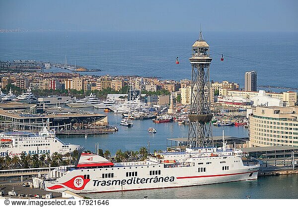 BARCELONA  SPAIN  APRIL 15  2019: Aerial view of Barcelona city skyline with city traffic and port with yachts and ferry ships and Barcelona's Port Cable Car. Barcelona  Spain  Europe