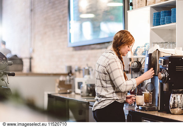 Barista preparing coffee in cafe
