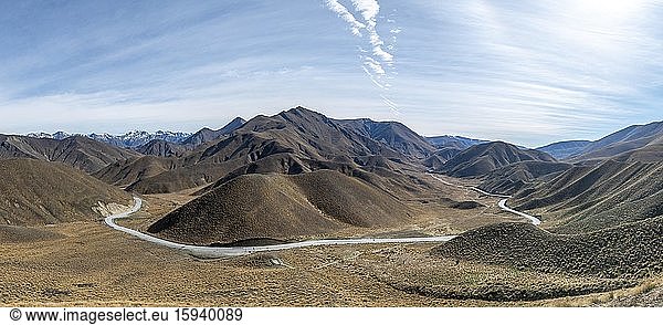 Barren mountain landscape with pass road  Lindis Pass  Southern Alps  Otago  South Island  New Zealand  Oceania