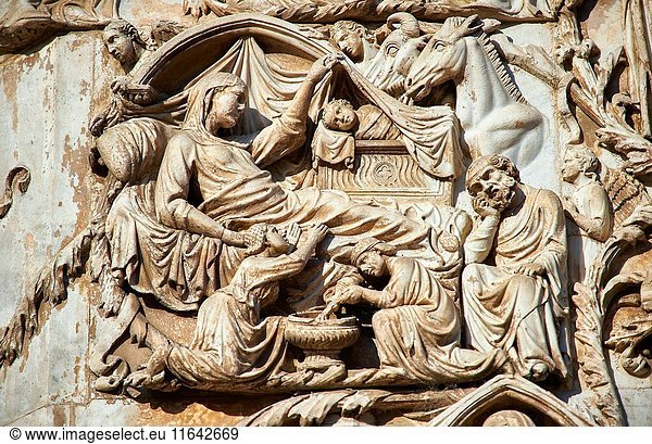 Bas-relief sculpture panel scene of the Nativity by Maitani around 1310 on the14th century Tuscan Gothic style facade of the Cathedral of Orvieto  Umbria  Italy.