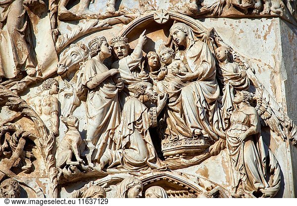 Bas-relief sculpture panel scene of the Tree Kings bringing gifts to the baby Christ by Maitani around 1310 on the14th century Tuscan Gothic style facade of the Cathedral of Orvieto  Umbria  Italy.
