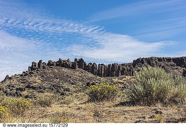 Basalt columns formed when molten lava cooled towering over the Eastern Washington high desert near George; Washington  United States of America