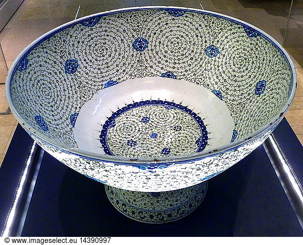 Basin with "Golden Horn" Design  Turkey  probably Iznik. About 1545. This basin is decorated with tight concentric scrolls in black  which bear tiny leaves and flowers. Design named "Golden Horn" because examples excavated near the inlet in Istanbul known as the Golden Horn.