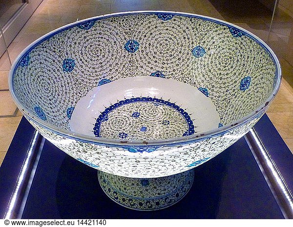 Basin with "Golden Horn" Design  Turkey  probably Iznik. About 1545. This basin is decorated with tight concentric scrolls in black  which bear tiny leaves and flowers. Design named "Golden Horn" because examples excavated near the inlet in Istabbul known as the Golden Horn