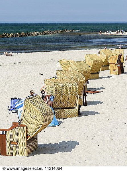 Beach at the Baltic Sea with typical Strandkoerben (beach chairs). Wustrow on Fischland Peninsula. Europe, Germany, West-Pomerania, June