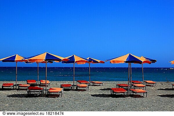 Beach chairs and umbrellas on the beach  Crete  Greece  Europe